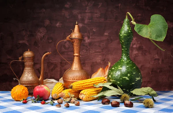 Decorative pumpkins, corn and metal jugs — Stock Photo, Image