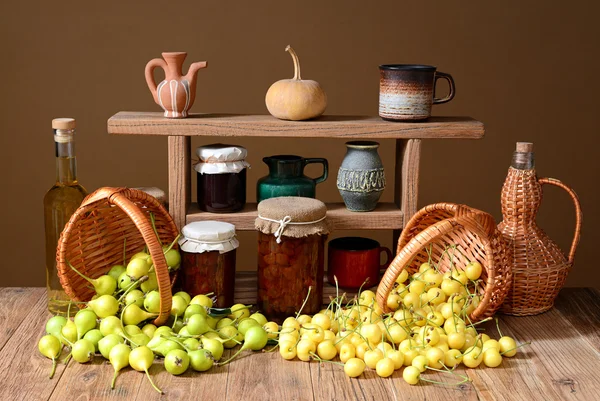 Fresh pears, cherries in wicker basket — Stock Photo, Image