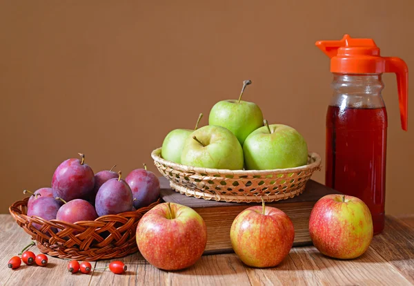 Apples and plums with juice