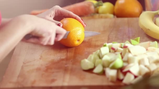 Woman cutting orange — Stock Video