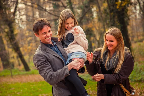 Family  walk in a park — Stock Photo, Image