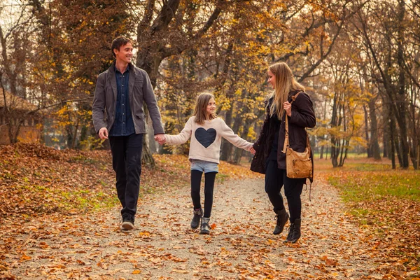 Family walk in a park — Stock Photo, Image