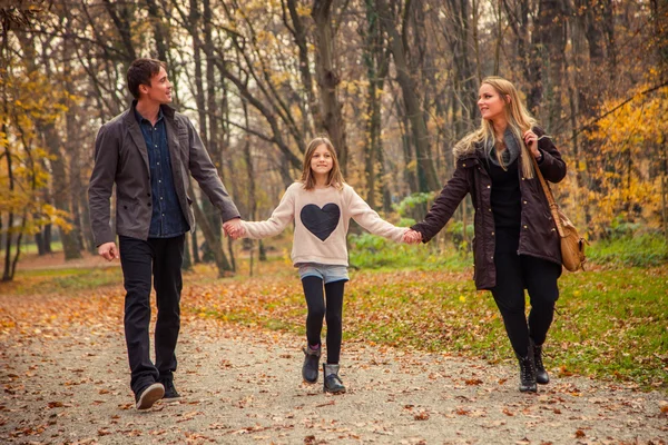 Family walk in a park — Stock Photo, Image