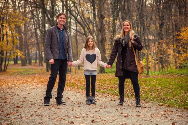 Family walk in a park — Stock Photo, Image