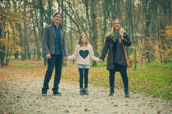 Family walk in a park — Stock Photo, Image