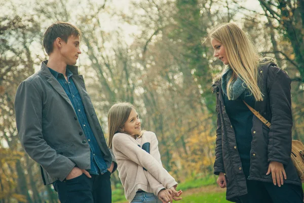 Family  walk in a park — Stock Photo, Image