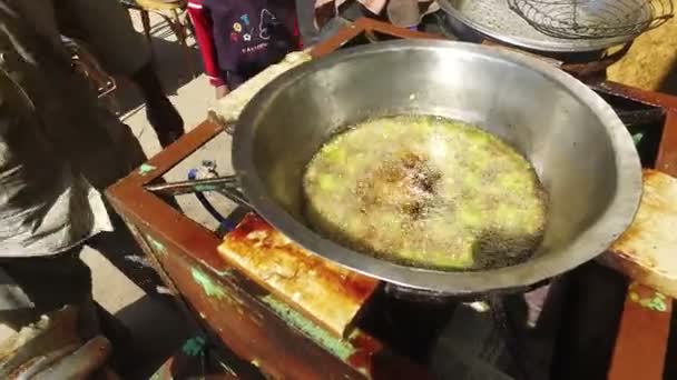 Man frying falafel balls — Stock Video