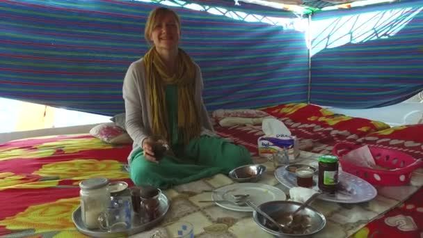 Woman drinking coffee on boat — Stock Video