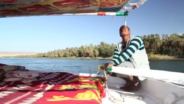Man sailing down river with felucca — Stock Video