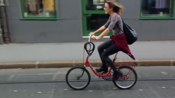 Woman cycling on the street — Stock Video