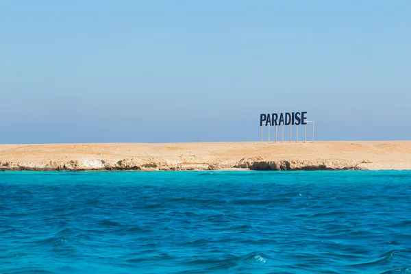 Paradise sign on sand — Stock Photo, Image