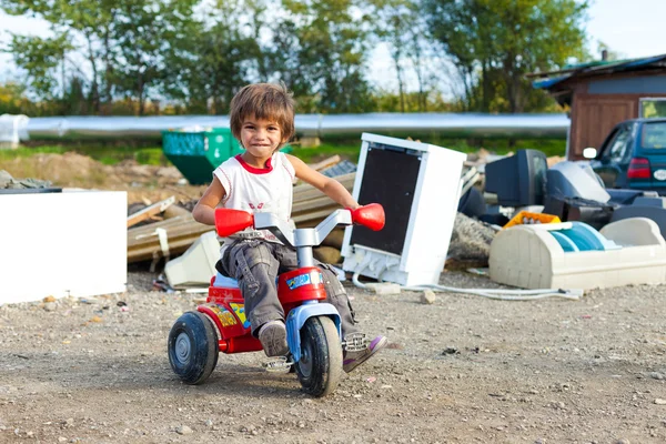 Boy sitting on small bike — Stock Photo, Image