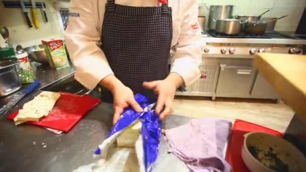 Chef cutting cheese in the restaurant kitchen — Stock Video