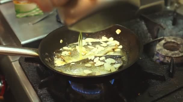 Fish frying in a pan — Stock Video