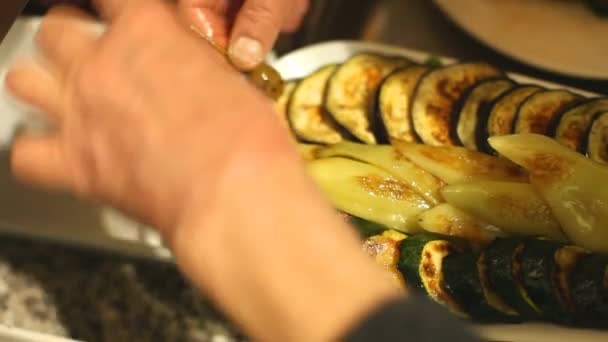 Chef serving eggplant slices — Stock Video