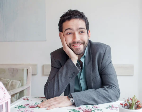 Man wearing jacket sitting in restaurant — Stock Photo, Image