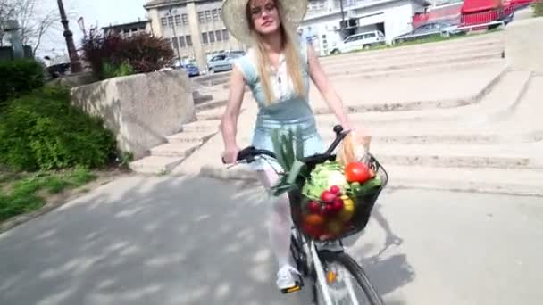 Girl riding bike with basket — Stock Video