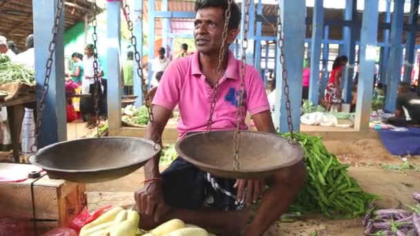 Man sitting in front of his scale — Stock Video