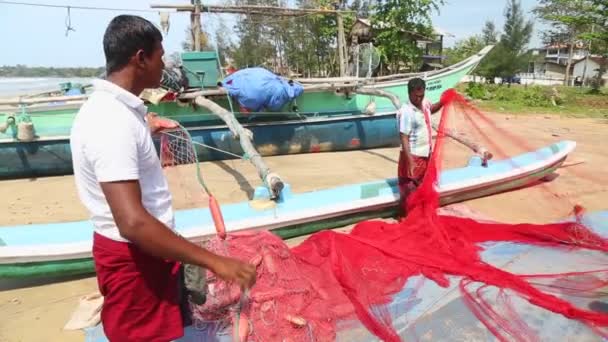 Local fishermen sorting nets — Stock Video