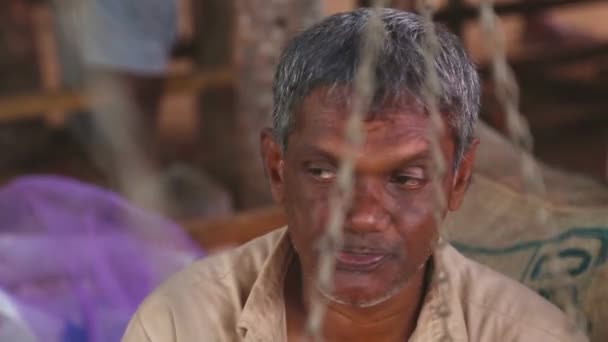 Local elderly man at Hikkaduwa Sunday market — Stock Video