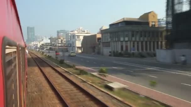 View of Colombo city traffic from passing train — Stock Video