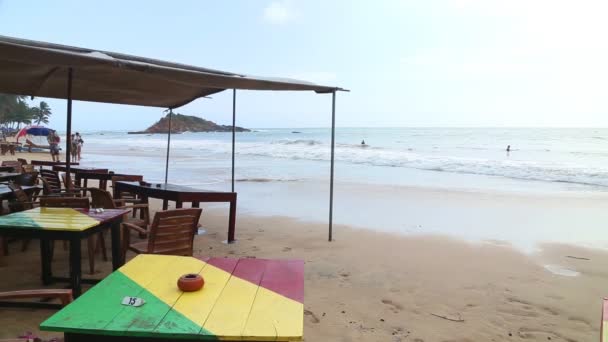 Beach bar being washed up by waves — Stock Video