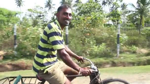 Local man riding bicycle — Stock Video