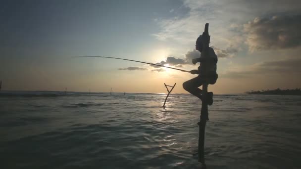 Fisherman on a fishing pole — Stock Video