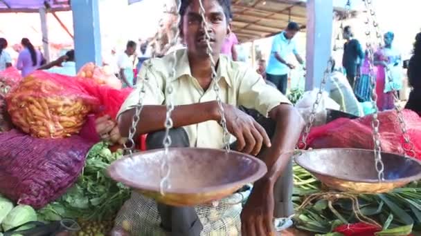 Local man sitting in front of his scale — Stock Video