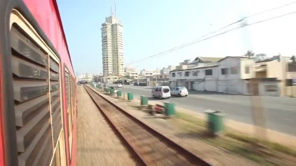 View of Colombo city traffic from passing train — Stock Video