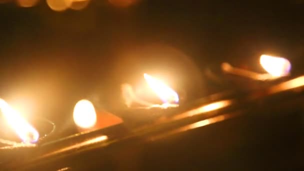 Burning candles in the Temple — Stock Video