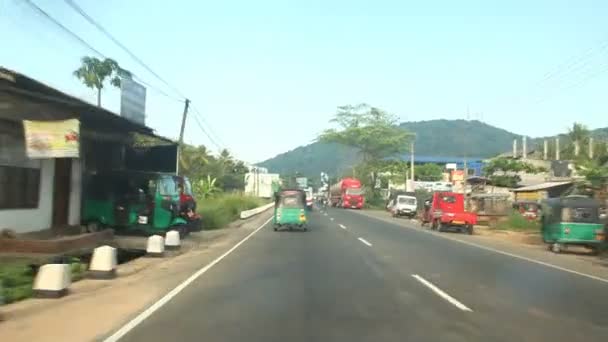 Kandy suburbs traffic from a moving car. — Stock Video