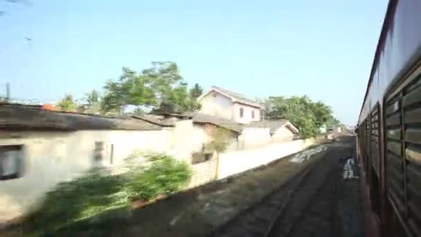 Colombo suburbs from passing train — Stock Video