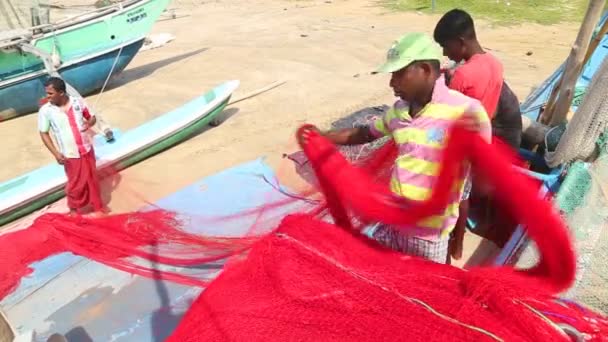 Local fishermen sorting nets — Stock Video