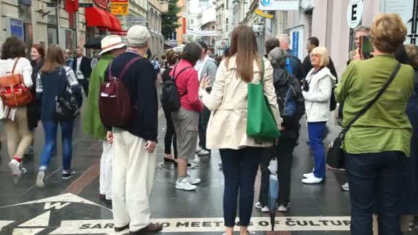 Locals posing in front of street sign Sarajevo meeting of cultures — Stock Video