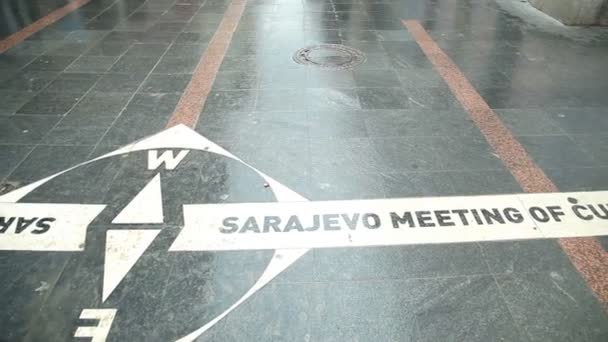 Pan view of Sarajevo meeting of cultures written on the street of Sarajevo, Bosnia — Stock Video