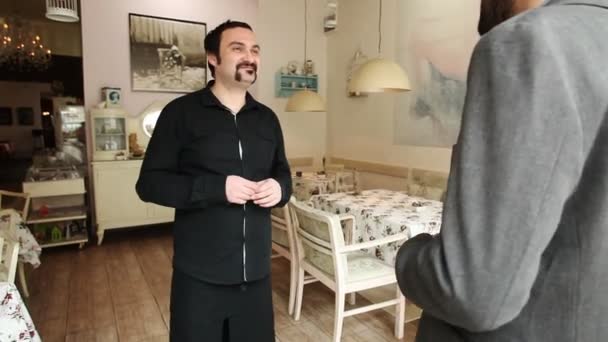 Man seated in restaurant — Stock Video