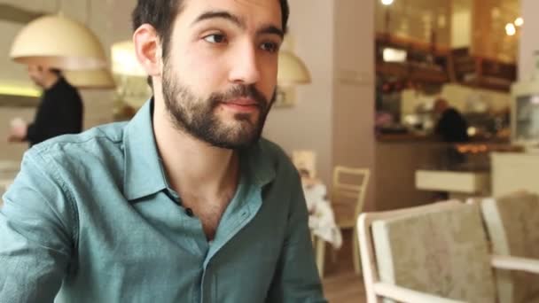 Man drinking wine in a restaurant — Stock Video