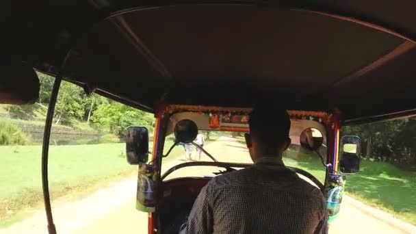 Tuktuk driving on dirt track — Stock Video