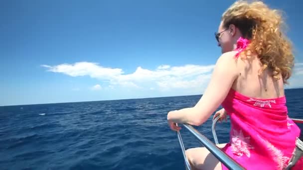 Woman sitting on bow of sailing boat enjoying view of sea — Stock Video