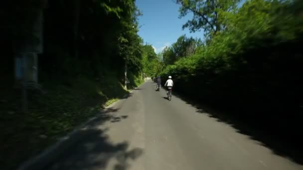 Retired couple cycling on road — Stock Video