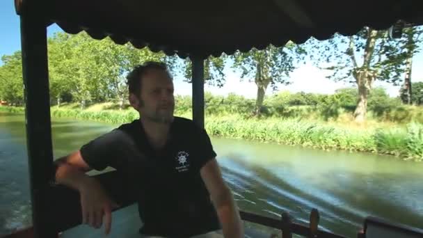 Captain driving tourists on barge — Stock Video