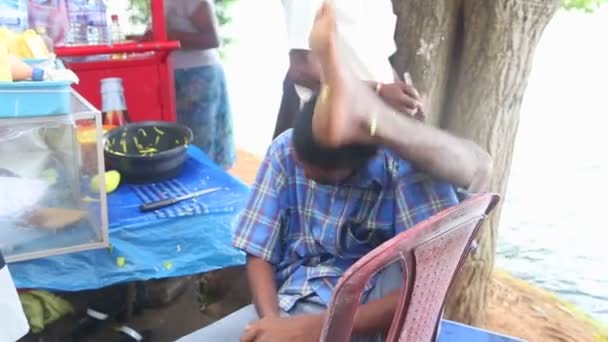 Man putting his leg behind his head — Stock Video
