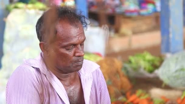 Local man selling vegetables — Stock Video