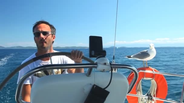 Skipper on sailing boat — Stock Video