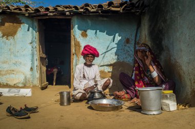 Rabariwoman sits next to husband