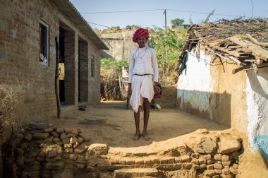 Rabari tribesman stands in courtyard