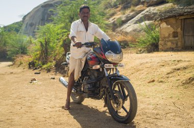 man shows off his motorbike
