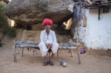 Elderly Rabari tribesman sits