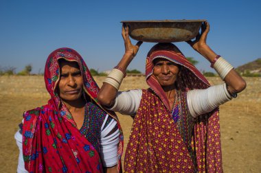 ribeswomen stand in field